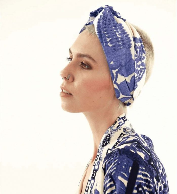 How to style a kimono for casual boho-style. Woman wearing a blue One Hundred Stars kimono and headband.