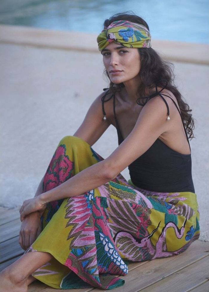 How to dress up a kimono​. Woman wearing black top with yellow One Hundred Stars palazzo pants and matching headband. 